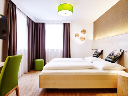 Naturhotel - Recyclingpapier - Doppelzimmer Superior Gartenhaus - Das Grüne Hotel zur Post - 100% BIO