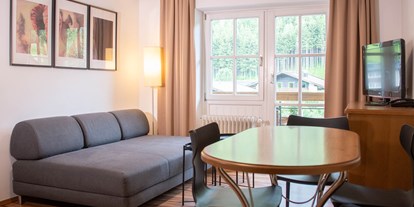 Naturhotel - Bio-Restaurant (nur für Hotelgäste): Öffentliches Restaurant - Salzburg - Wohnzimmer - The RESI Apartments "mit Mehrwert"