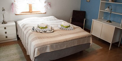 Naturhotel - auch für Familien mit Kindern - Schweden - Doppelbett. - Lilla Sverigebyn
