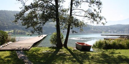 Naturhotel - Müllmanagement: Mülltrennung - Eberstein - Badestrand mit Boot und Steg für Ihren veganen Bio-Urlaub - Loving Hut am Klopeiner See