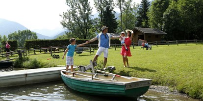 Naturhotel - Naturarena - Hauseigener Badesteg mit Ruderboot - BIO-Kinderhotel Kreuzwirt