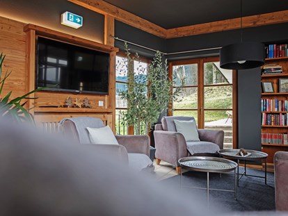 Naturhotel - PLZ 82398 (Deutschland) - Unser neuer Wintergarten – der ideale Platz für gemütliche Stunden mit einem guten Buch und einer Tasse frischen Bio-Kaffee.  - moor&mehr Bio-Kurhotel