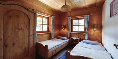 Naturhotel - Bio-Getränke - Ramsau am Dachstein - Schlafzimmer Sonnenwohnung im Waldhaus - Naturhaus Lehnwieser
