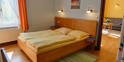Naturhotel - Umgebungsschwerpunkt: See - Schlafzimmer - Gut Nisdorf Ferienapartments