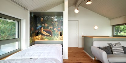 Naturhotel - Putbus - Im obergeschoss gibt es eine Aufbettung in Form eines Schrankbetts - im-jaich Naturoase Gustow